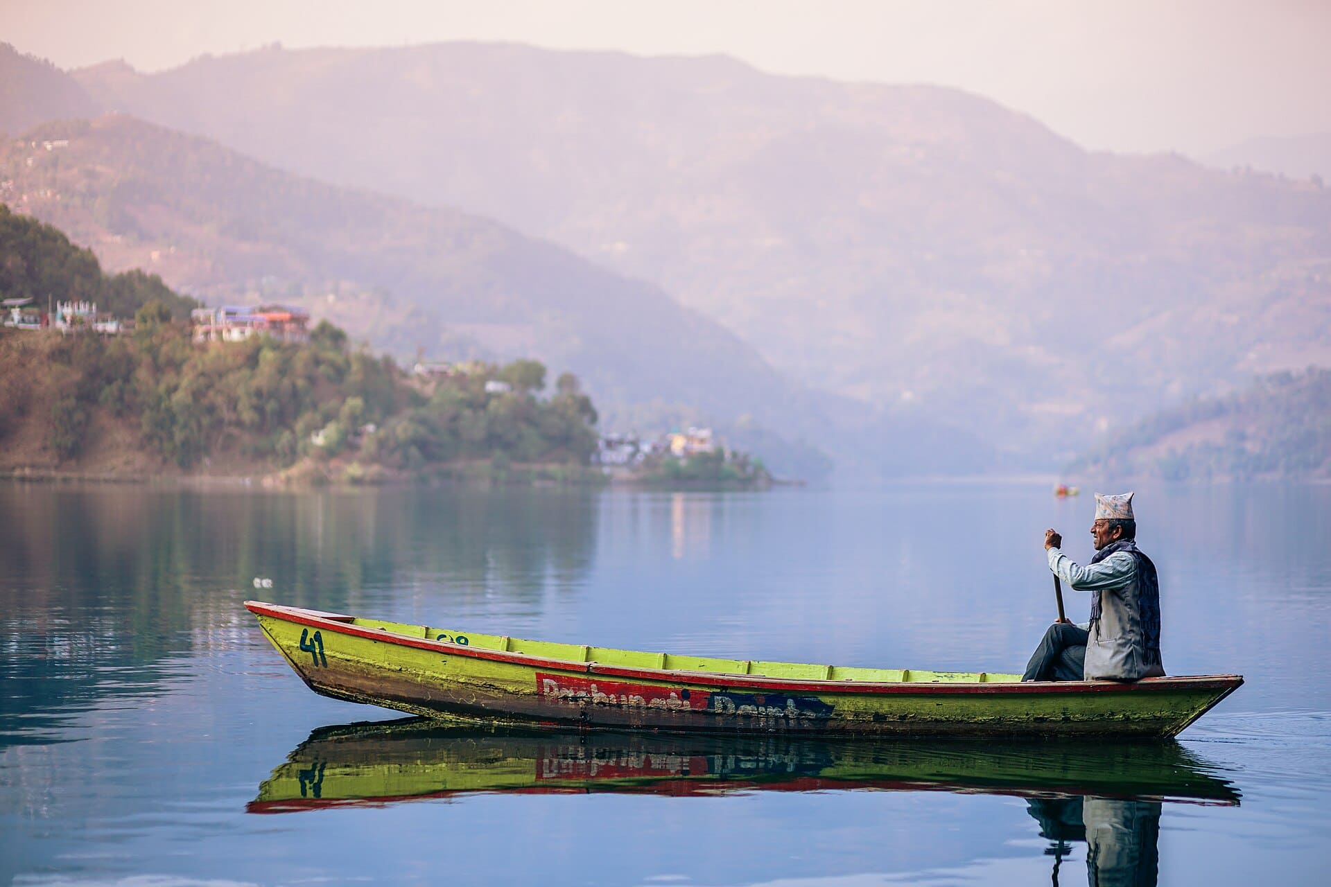 Traditional boating on Phewa Lake, Pokhara